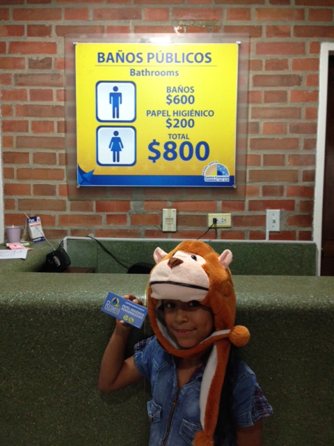 In the land of pay toilets - with an extra surcharge for toilet paper (of course!).  This little girl (all ready for Halloween) was happy to pose holding my TP at the Medellin bus station